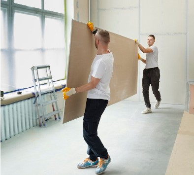 foto de dois homens colocando drywall em contagem